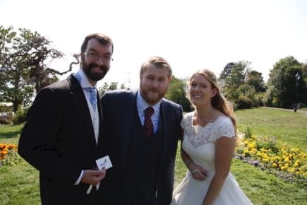 Chris with Bride and Groom on wedding day